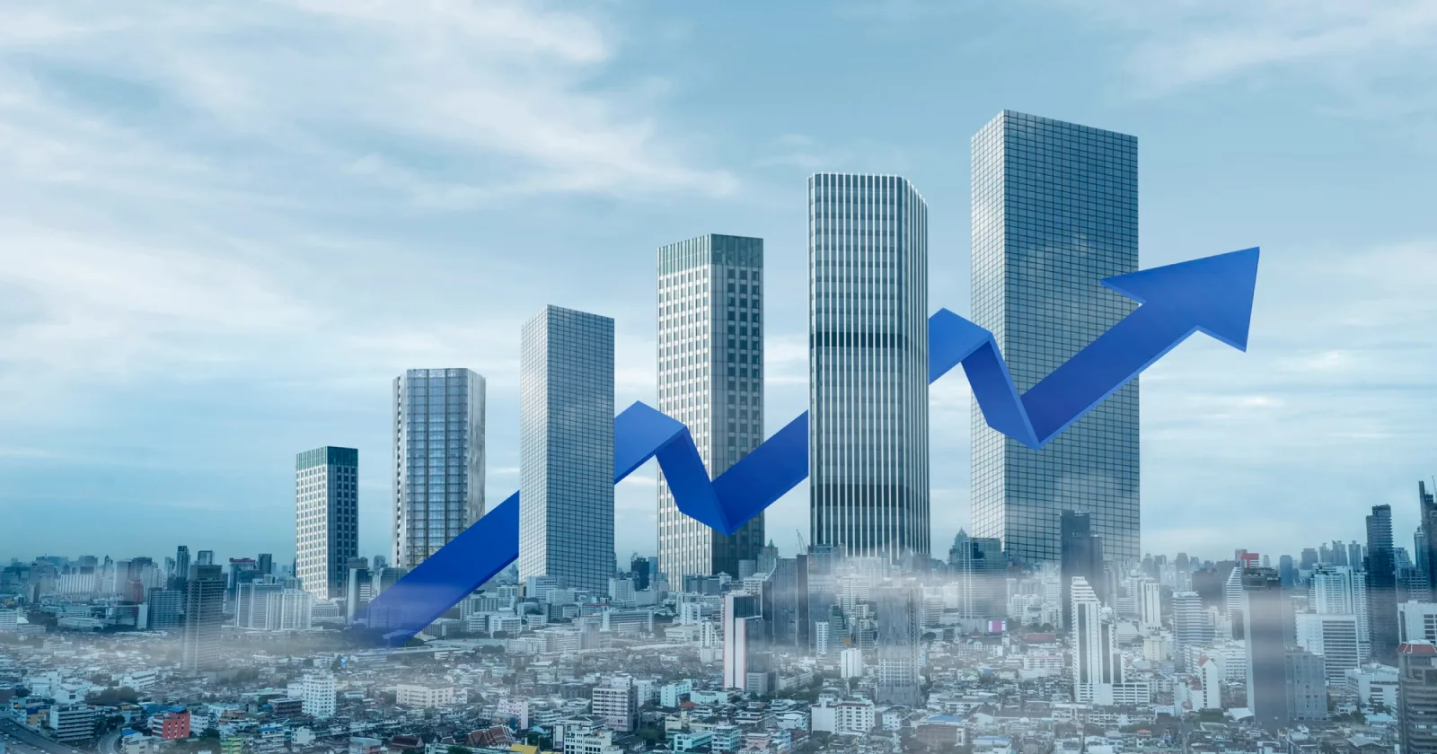 City skyline with upward growth arrows
