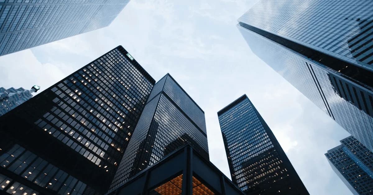 Modern glass office towers viewed from street level