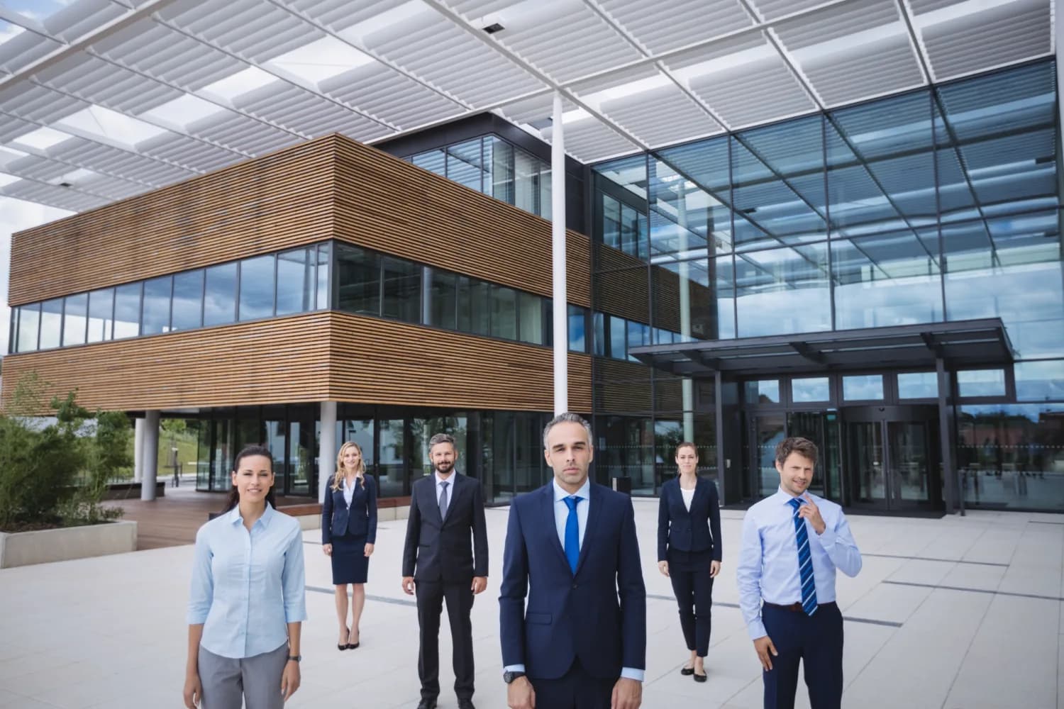 The Gratis team outside a corporate office building